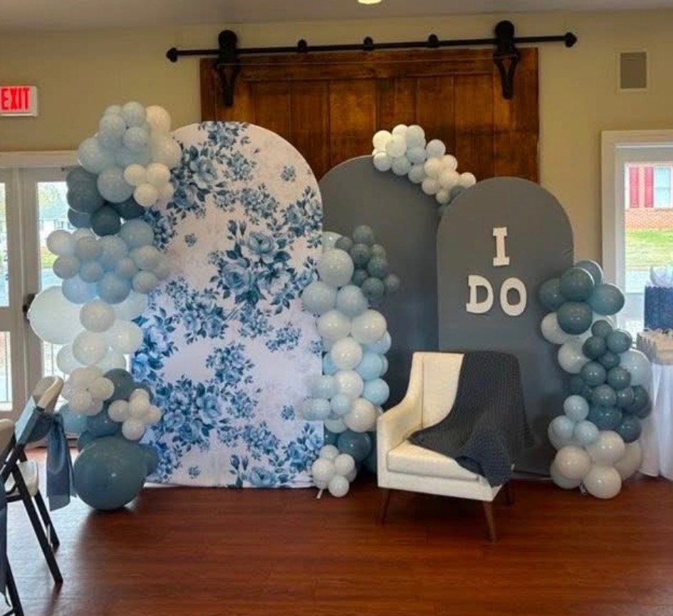 Blue balloon décor with floral party backdrop
